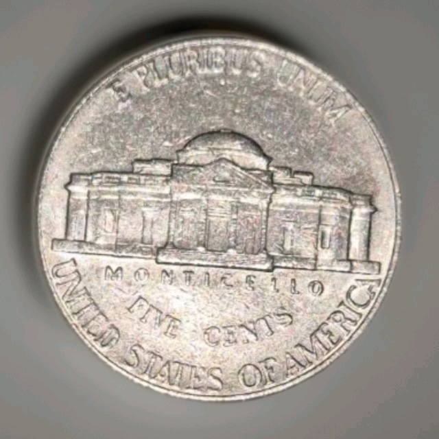 2001 nickel partial collar strike error showing raised railroad rim ridge along part of the coin edge
